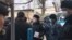 People looking for their relatives gather outside a detention center in Shymkent on January 10.