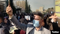 Protesters outside the Iranian parliament.