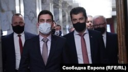 Bulgaria's parliament speaker, Nikola Minchev (center), walks next to Prime Minister Kiril Petkov at a meeting of the National Security Advisory Council on January 10. 