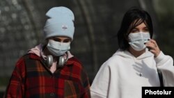 Armenia - Pedestrians wear mandatory face masks in Yerevan, November 2, 2021.