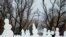 RUSSIA CHRISTMAS HOLIDAYS -- A girl makes snowmen during the Christmas holidays in Aviator’s Park in St. Petersburg, Russia, 05 January 2022. Russians celebrate the Christmas which is observed on 07 January according to the Russian Orthodox Julian calenda