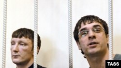 Sergei Mozgalev (left) and Yuri Pliyev, two of the defendants in the Kondopoga case