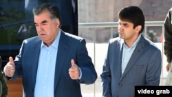 Tajik President Emomali Rahmon with his son Rustam (file photo)