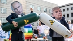 German antinuclear activists wear masks of Donald Trump (right) and Vladimir Putin holding mock missiles as they protest against the termination of the Intermediate-Range Nuclear Forces Treaty in 2019.