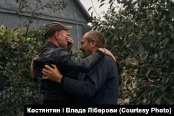 A son hugs his father for the first time after he spent six months living under Russian occupation in the Kharkiv region.