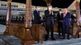 China's Xi Jinping is welcomed by Uzbek President Shavkat Mirziyoev (right) at an airport in Samarkand on September 14, 2022.