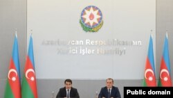 Azerbaijan - Foreign Minister Jeyhun Bayramov and presidential aide Hikmet Hajiyev meet with foreign diplomats, Baku, September 13, 2022.