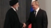 Russian President Vladimir Putin (right) shakes hands with Iranian President Ebrahim Raisi in Samarkand, Uzbekistan, on September 15.