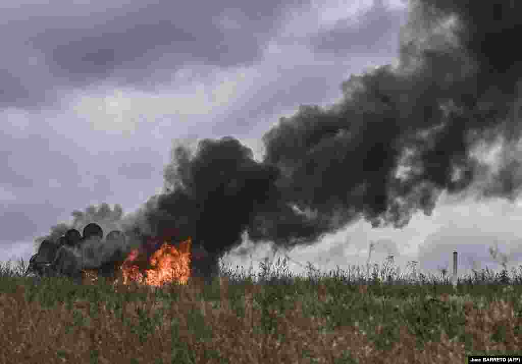 A Russian MT-LB armored personnel carrier burns in a field on the outskirts of Izyum on September 14.&nbsp;