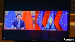 Chinese President Xi Jinping (left) and European Commission President Ursula von der Leyen (right) take part in a video conference, which also included European Council President Charles Michel and European Union foreign policy chief Josep Borrell, on April 1. 