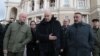 Greek Foreign Minister Nikos Dendias (center) meets with Odesa Myor Hennadiy Trukhanov (left)near the city's Opera Theater on April 3,