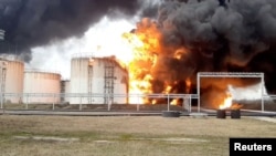 A still image of the fuel-depot on fire in Belgorod on April .