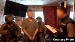 Скриншот видео КНБ о задержании подозреваемого в «подготовке покушения» на президента