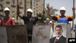 The Coptic cleric's killing comes against a backdrop of mounting bloodshed between supporters of ousted Egyptian President Muhammad Morsi and the military that displaced him.