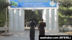 turkmenistan. would-be students in front of hospital waitting to obtain health certificate