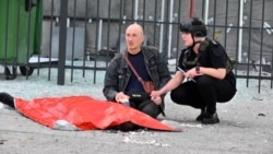 Father Mourns Over Son's Body After Russian Attack On Kharkiv