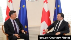 The EU's David McAllister (left) and Georgian Prime Minister Irakli Garibashvili hold talk on July 21 in Tbilisi.