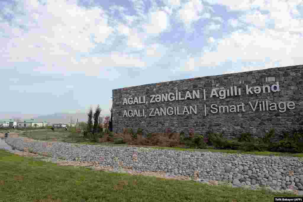 Signage at the entrance to Agali. The concept of &ldquo;smart villages&rdquo; in Azerbaijan has been promoted by the World Bank, which published a report in 2020 calling for highly-digitized settlements to be built across Azerbaijan &ldquo;to improve rural economic opportunities, infrastructure, services, and governance.&rdquo; &nbsp;