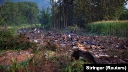 Debris is seen at the crash site of an Antonov An-12 cargo plane owned by a Ukrainian company, near Kavala, Greece, on July 17.