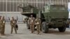 Fotografie generică cu sisteme de rachete cu lansare multiplă HIMARS, alături de soldați americani. Președintele ucrainean Volodimir Zelenski a spus că rachetele americane HIMARS au schimbat cursul războiului împotriva Rusiei.