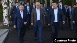 Uzbek President Shavkat Mirziyoev (left), Kazakh President Qasym-Zhomart Toqaev (center), and Kyrgyz President Sadyr Japarov arrive for talks at a Central Asia summit in Cholpon-Ata, Kyrgyzstan, on July 20. 