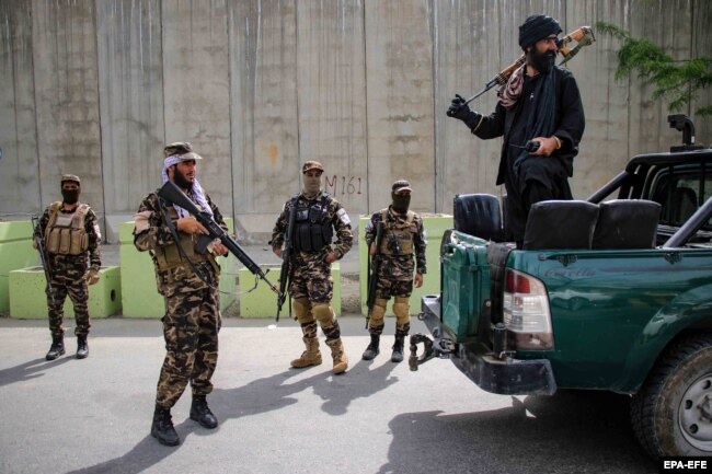 Taliban soldiers stand guard in the Shirpur neighborhood after the drone strike that killed Al-Qaeda leader Ayman al-Zawahri in Kabul on August. 2