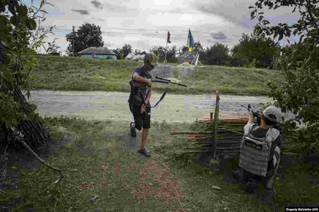 Maksym and Andriy retire to a fallback position at their play checkpoint on July 20. Hidden secondary firing positions are standard at the real checkpoints on Ukraine&#39;s highways.&nbsp;
