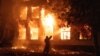 A firefighter attempts to put out a blaze at a hospital hit by a Russian missile strike in Mykolayiv on August 1.