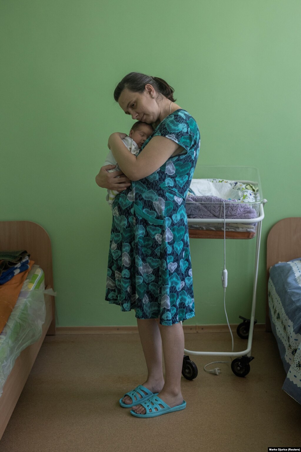 Olena, 36 vjeçe, duke mbajtur foshnjën e saj, Mykhaylo.