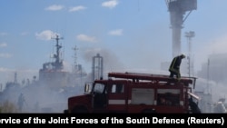 Ukrainian firefighters work at the site of a Russian missile attack on the port of Odesa on July 23. 