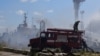 Пожарникари се борят с последствията от атаката срещу пристанището в Одеса от събота. Снимката е на Южното оперативно командване на украинската армия