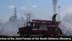 Firefighters work at a site of a Russian missile strike at the sea port of Odesa on July 23.
