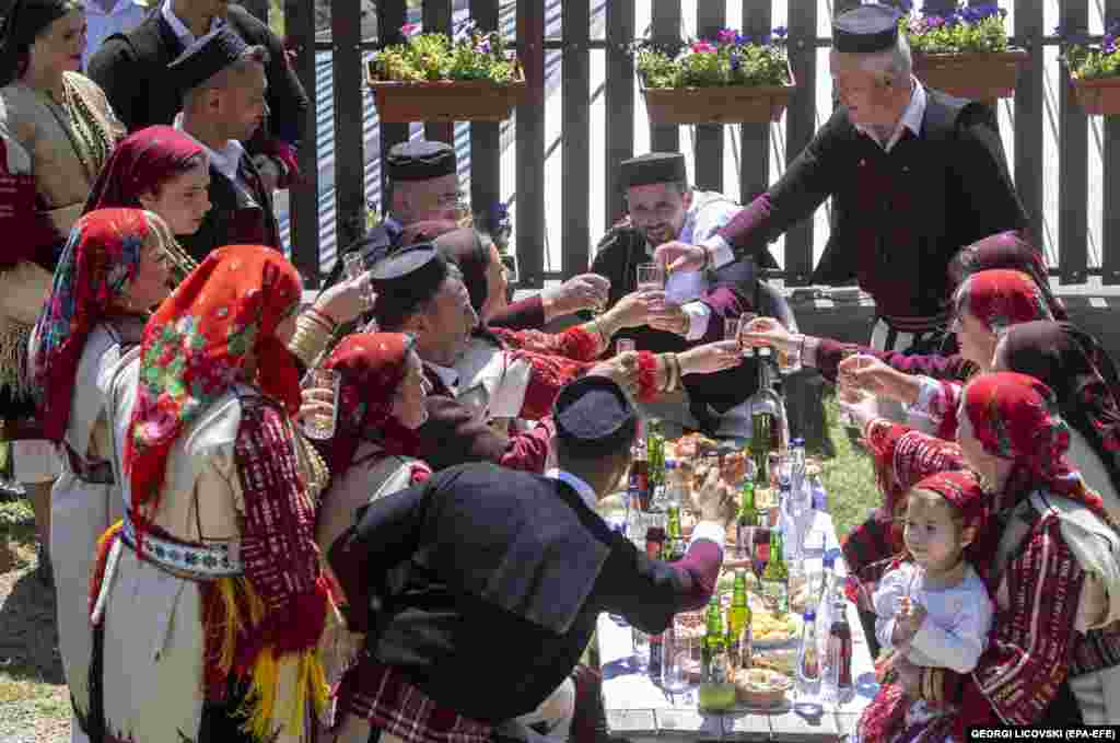 Relatives celebrate the nuptials with homemade brandy.