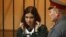 Pussy Riot member Nadezhda Tolokonnikova looks out from a holding cell during a court hearing in the town of Zubova Polyana on April 26.