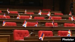 Armenia - Karabakh flags on empty seats of opposition lawmakers boycotting a session of the Armenian parliament, Yerevan, May 25, 2022.