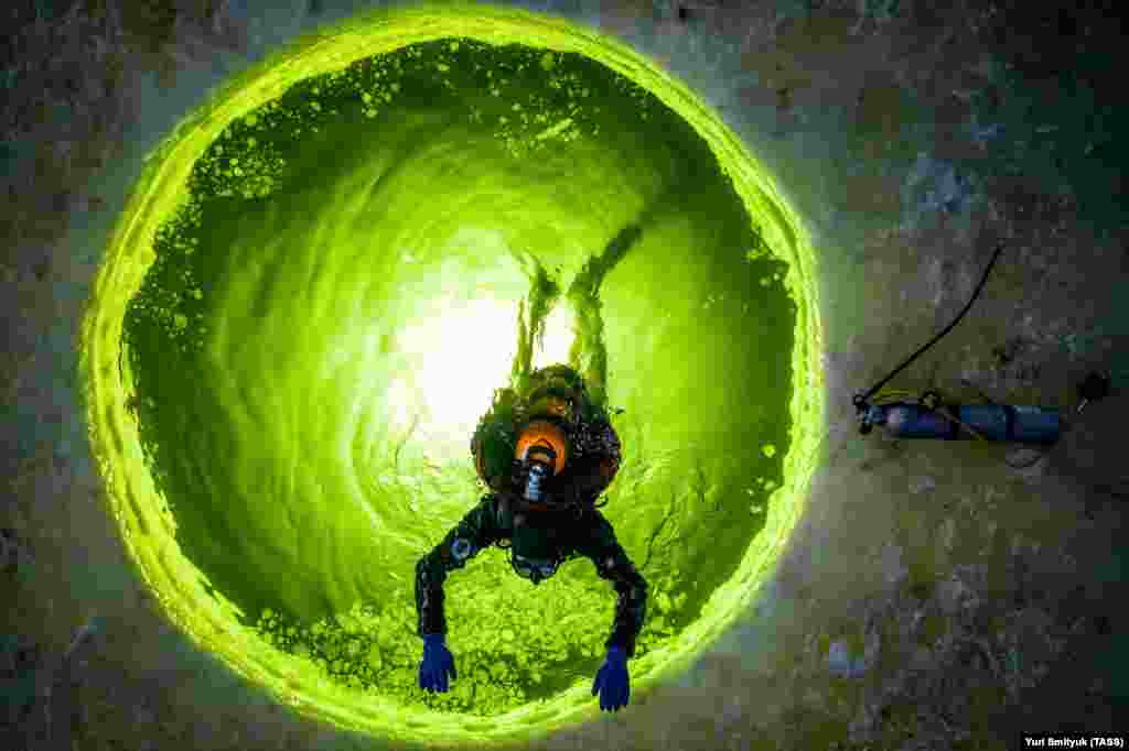 A scuba diver takes part in an ice-diving class at the Sea Frogs scuba-diving center in the Russian Far East city of Vladivostok.