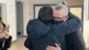 Belarusian businessman Alyaksander Vasilevich is hugged by a supporter after leaving the courtroom in Minsk on February 4. 