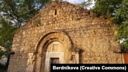 A 2018 photo of the Holy Mother of God Church in the recaptured Hadrut region. Armenian script is visible above the entrance.