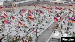 Armenia - Armenian flags fly by the graves of soldiers killed during the 2020 war in Nagorno-Karabakh, January 28, 2022.