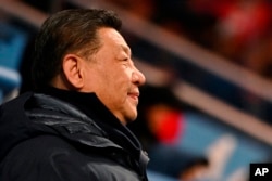 Președintele chinez, Xi Jinping, așteaptă începerea ceremoniei de deschidere a Jocurilor Olimpice
