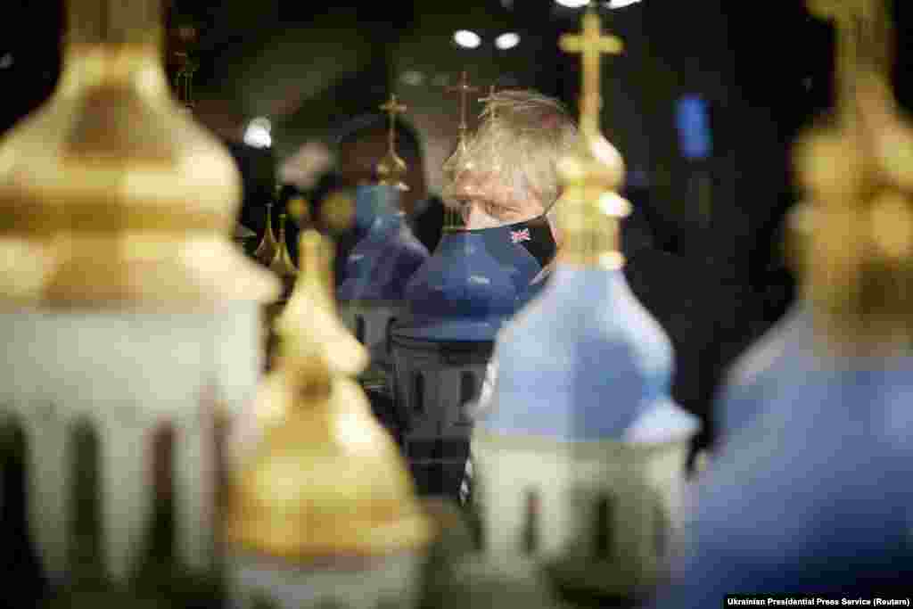 British Prime Minister Boris Johnson looks on during a visit at St. Sophia&#39;s Cathedral in Kyiv.