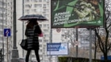 A pedestrian walks past a Russian military recruitment poster in Moscow. (file photo)