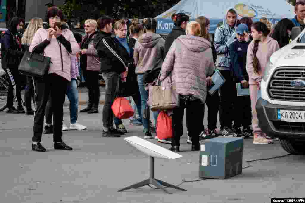 A Starlink terminal is seen at a mobile passport application station in Ukraine&#39;s Kharkiv region on September 29. As Russian missile strikes, drone attacks, and shelling of energy infrastructure have left more and more Ukrainian villages, towns, and cities without power, Starlink terminals are vital to Ukraine&#39;s ability to connect to the outside world.