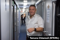 Vasyl Tkachenko is one of the train conductors on duty.
