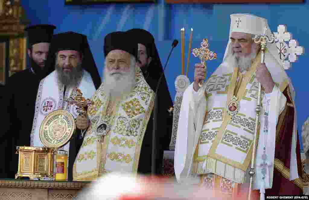 The relics were received at the altar by Patriarch Daniel (right), and Father Panteleimon (center). The sacred items were then placed for veneration on the Patriarchate Hill, where they will remain until October 28. &nbsp;