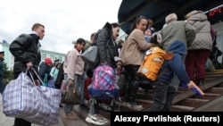 Civili evacuați din regiunea ucraineană herson, controlată de Rusia, 20 octombrie 2022. 