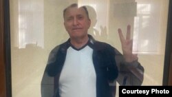 Oleksiy Kiselyov appears in court in the Crimean city of Simferopol in October 2022.