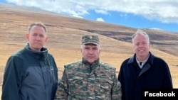 Armenia - U.S. State Department officials pose for a photograph with an Armenian military commnader in Gegharkunik province, October 24, 2022.