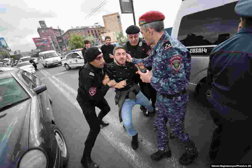 Armenian police forcibly detain a protester in Yerevan on May 4. Ongoing anti-government protests began on May 1 in the Armenian capital over fears that Prime Minister Nikol Pashinian is poised to make major concessions to Azerbaijan over the disputed Nagorno-Karabakh region.&nbsp;
