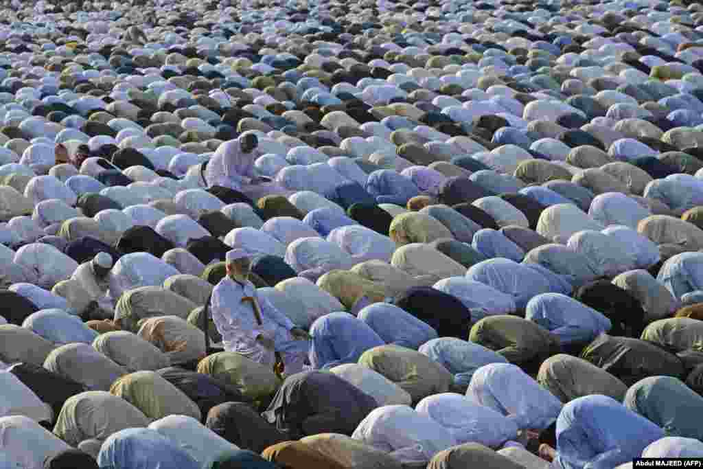 Muslim devotees offer a special morning prayer to start the Eid al-Fitr festival, which marks the end of the holy fasting month of Ramadan, in Peshawar, Pakistan, on May 2.&nbsp;
